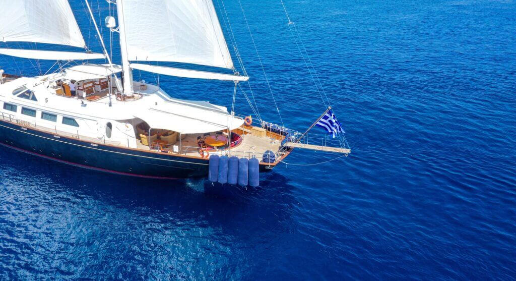 Sailing yacht charter in Greece. Private yacht sailing,Greek islands. Sailing yacht cruise with crew in Greece, Mediterranean.